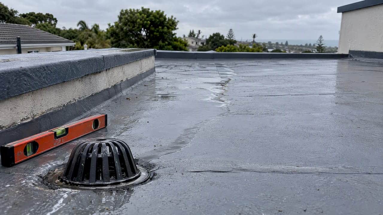 Shallow roof fall directing water toward drain